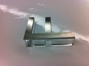 stainless steel letter mounted to acrylic letter 2